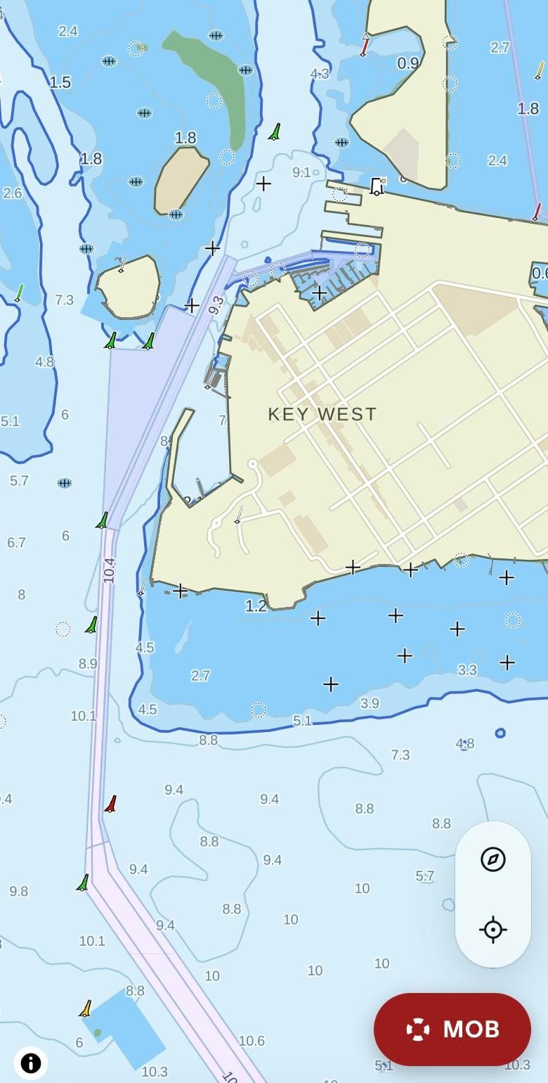 buoya chart of Key West: the dredged Main Ship Channel as a violet corridor, lateral buoys alongside, depth areas in shades of blue and the town on land